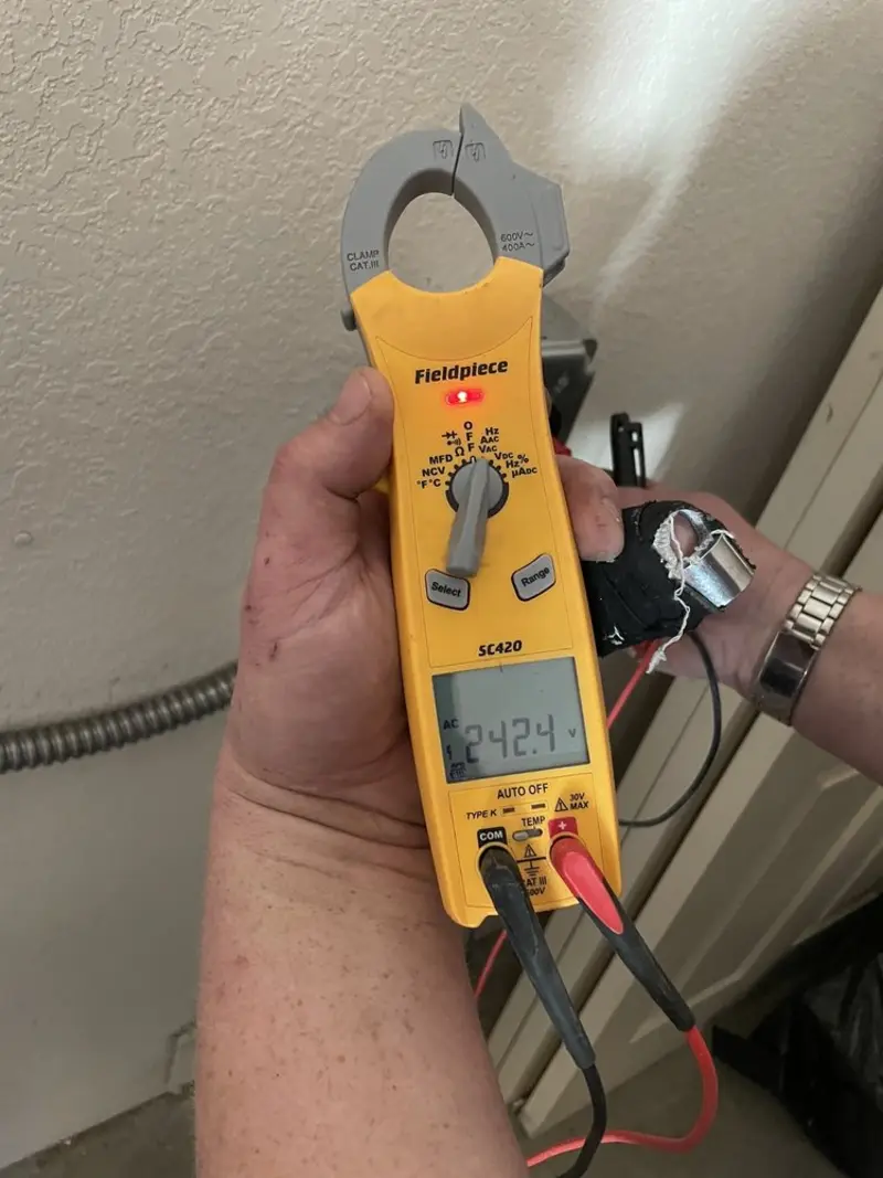 Voltage testing with clamp meter during Electrical Installation Services in Ellicott City